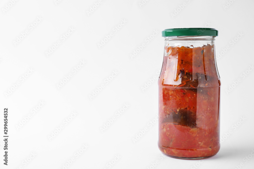 Jar with tasty vegetable sauce on white background. Pickled food Jar with tasty vegetable sauce on white background. Pickled food