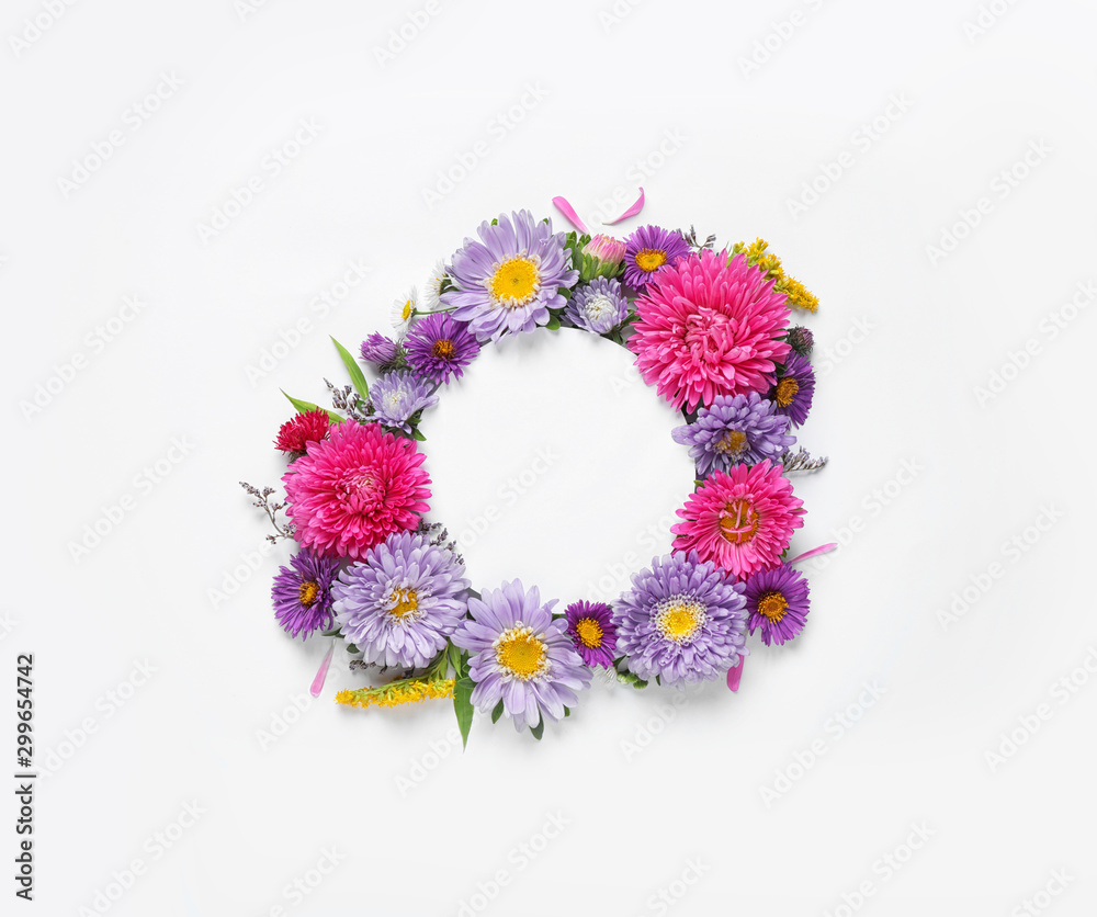 Composition with beautiful aster flowers and blank card on white background, top view. Space for text Composition with beautiful aster flowers and blank card on white background, top view. Space for text