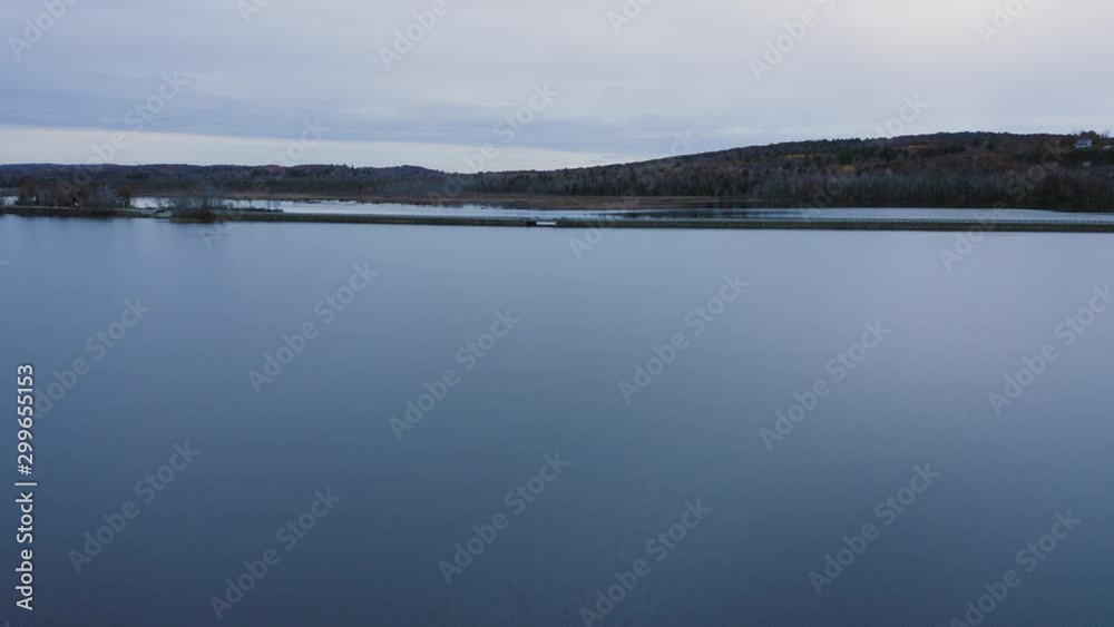Aerial flight over flat calm coastal water 4K Aerial flight over flat calm coastal water 4K