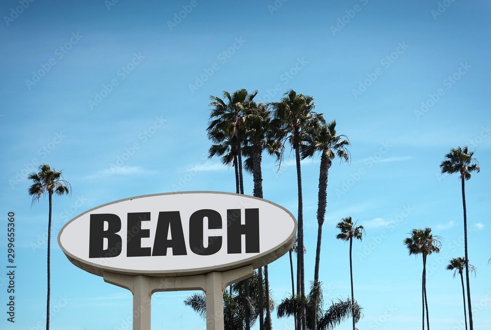 Naklejka premium aged and worn beach sign and palm trees