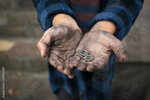 Принти на полотні Poor homeless child with coins outdoors, closeup