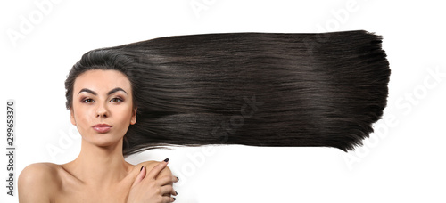 Portrait of beautiful young woman with healthy long hair on white background photo