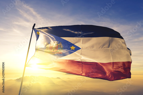 Mogi das Cruzes of Brazil flag waving on the top sunrise mist fog photo