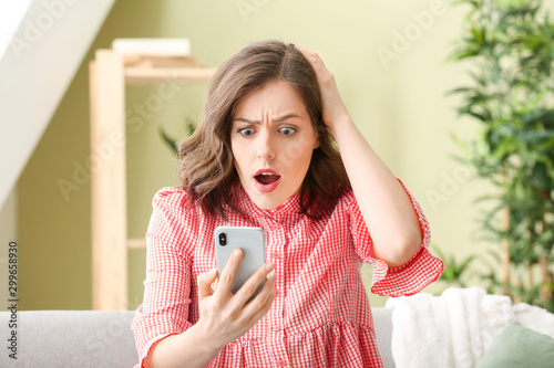 Surprised young woman with ...