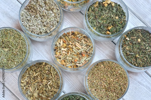 Set of various herbs. Herbal teas in jars on a wooden table.