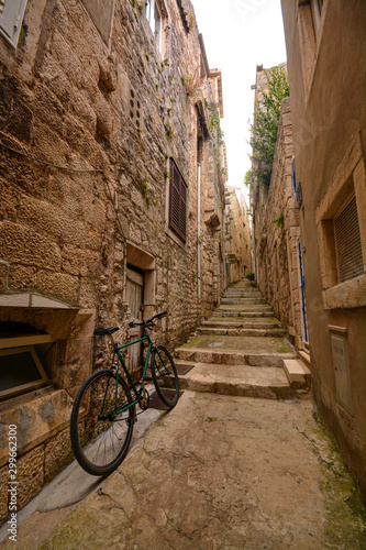 Magical street of Korcula with a bicycle