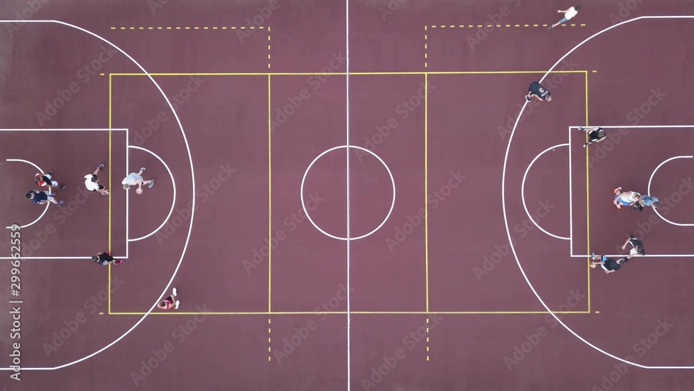 Fototapeta premium Men play basketball on the brown field. 4K video, 240fps, 2160p.