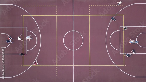 Men play basketball on the brown field. 4K video, 240fps, 2160p. © artjazz