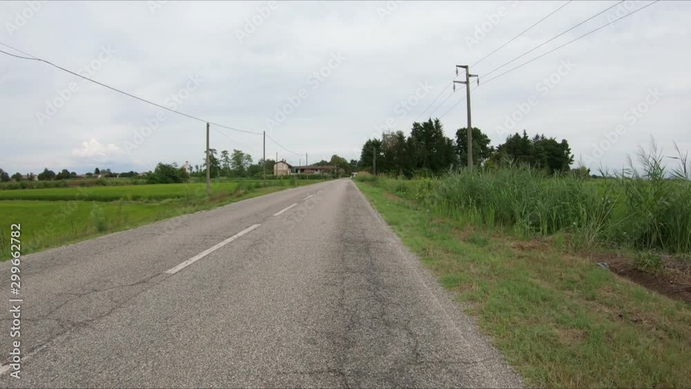SP6 paved road approaching Nicorvo town, province of Pavia, Lombardy region, Italy SP6 paved road approaching Nicorvo town, province of Pavia, Lombardy region, Italy