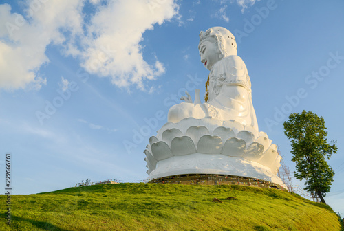 Big goddess statue named "Guanyin" located on the small hill at Wat Huay Pla Kung an iconic temple in Chiang Rai province of Thailand. 