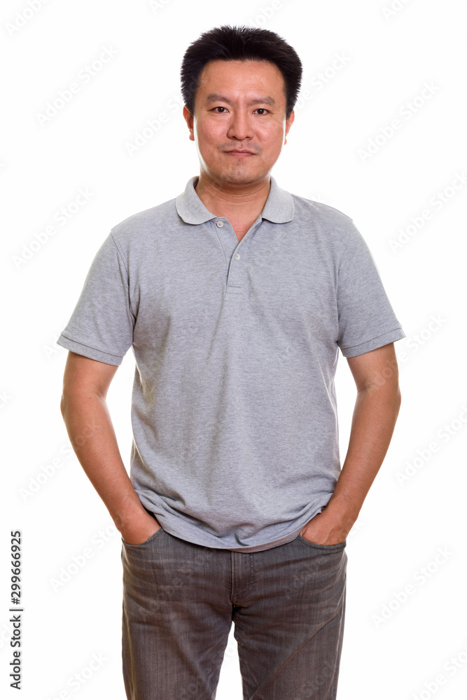 Studio shot of Japanese man isolated against white background Studio shot of Japanese man isolated against white background