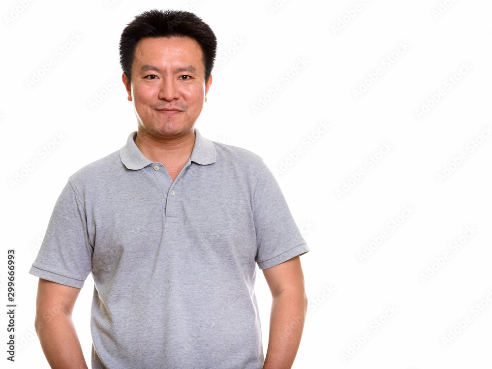 Studio shot of Japanese man isolated against white background Studio shot of Japanese man isolated against white background