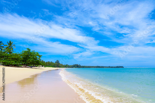 Fototapeta Naklejka Na Ścianę i Meble -  Pristine white sandy beach with aqua blue sea in Khao Lak close to Phuket Island on the Andaman Coast, Phang Nga Province, Thailand.