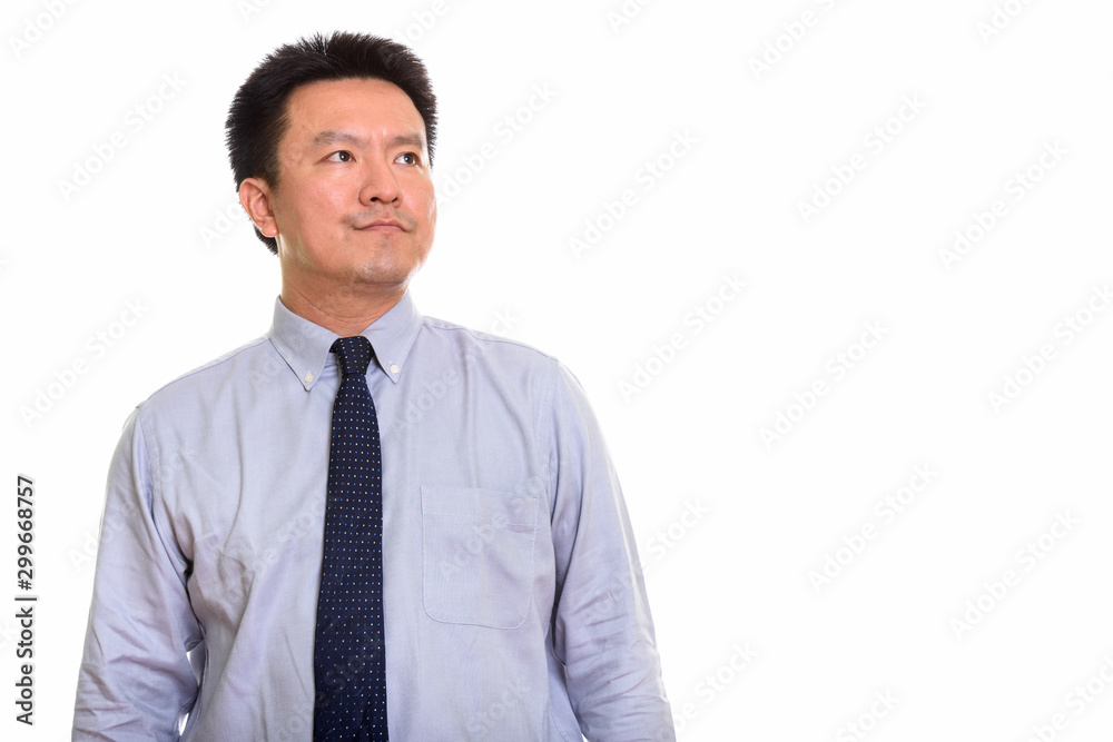 Studio shot of Japanese man isolated against white background Studio shot of Japanese man isolated against white background