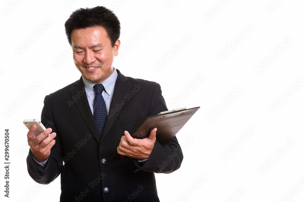 Studio shot of Japanese man isolated against white background Studio shot of Japanese man isolated against white background