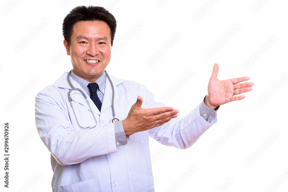Studio shot of Japanese man isolated against white background Studio shot of Japanese man isolated against white background
