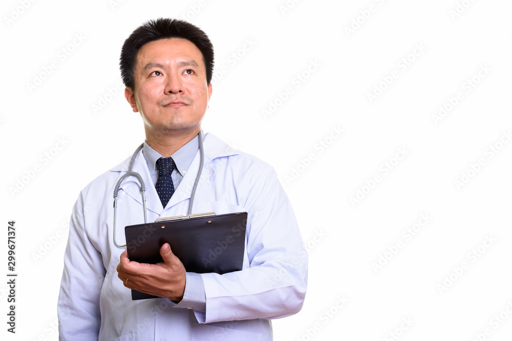 Studio shot of Japanese man isolated against white background Studio shot of Japanese man isolated against white background
