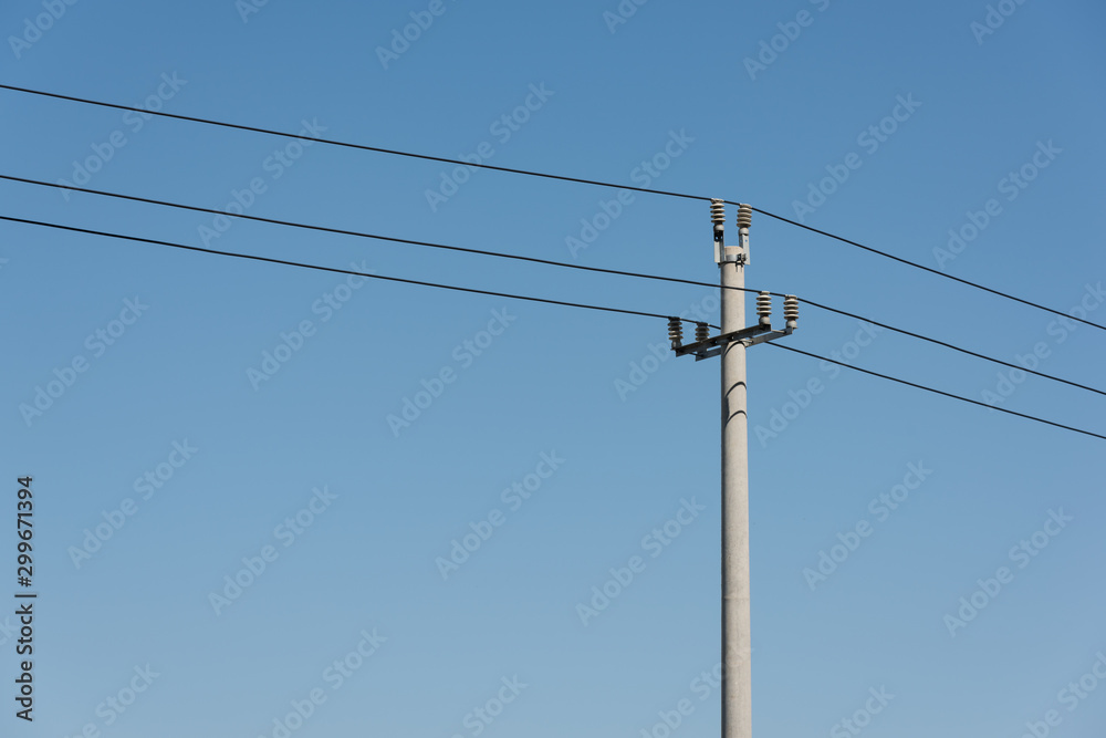 A power pole in a cloudless blue sky closeup A power pole in a cloudless blue sky closeup