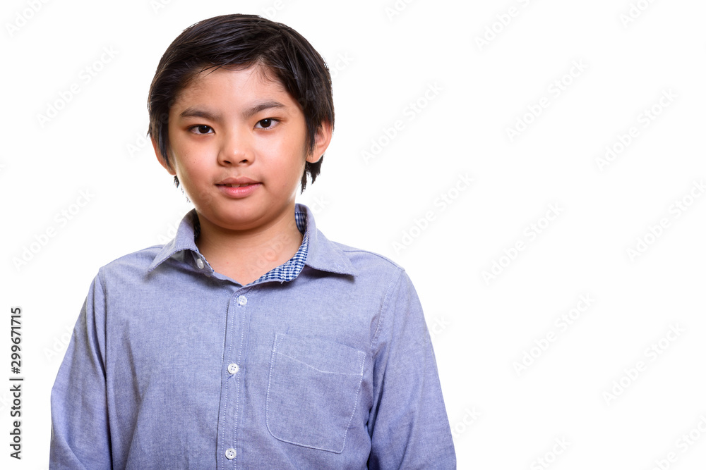 Studio shot of Japanese boy isolated against white background Studio shot of Japanese boy isolated against white background