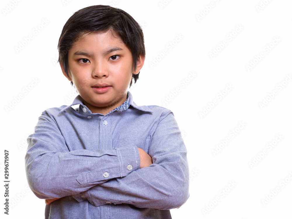 Studio shot of Japanese boy isolated against white background Studio shot of Japanese boy isolated against white background