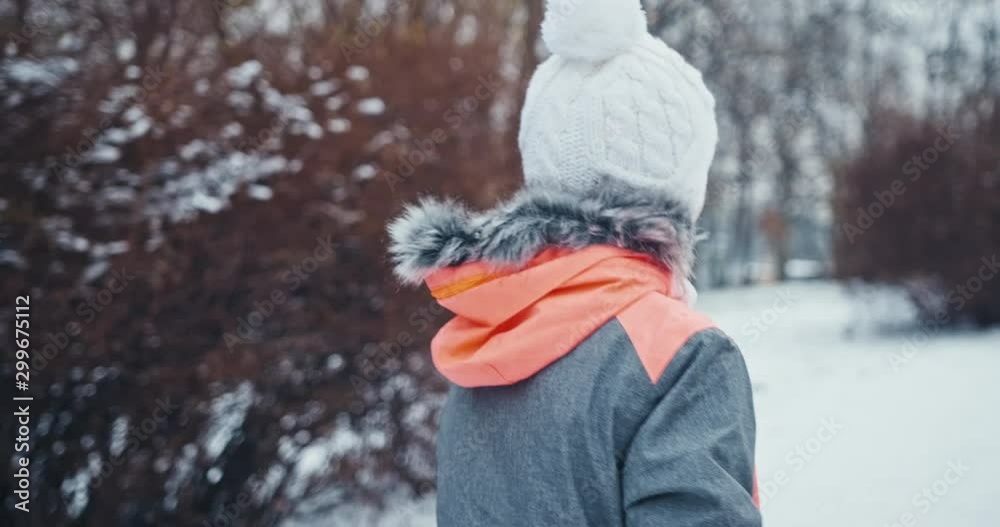 Close-up portrait the girl walking in the park. Preteen girl have fun in winter city park Close-up portrait the girl walking in the park. Preteen girl have fun in winter city park