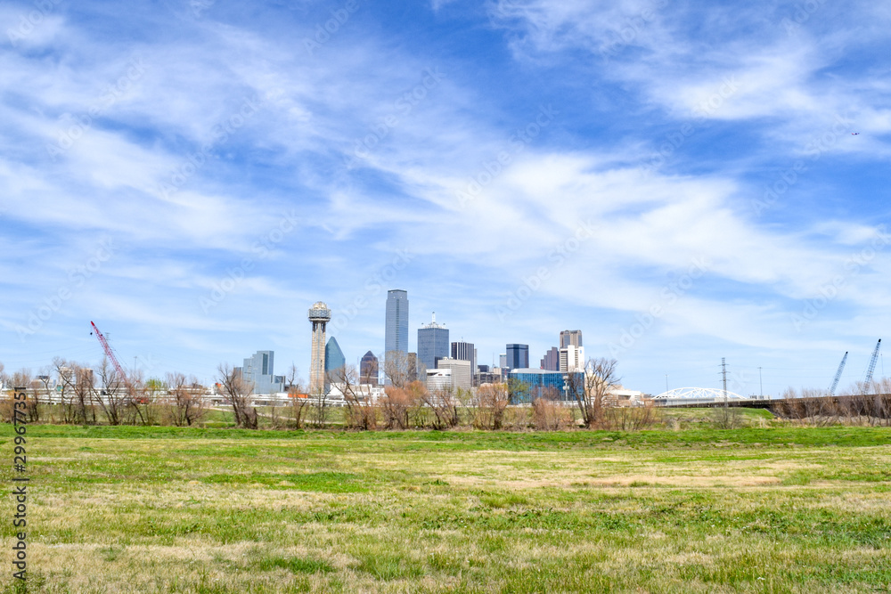 Skyline of Downtown Dallas and Expansive Green Meadow in Foreground - Dallas, Texas, USA Skyline of Downtown Dallas and Expansive Green Meadow in Foreground - Dallas, Texas, USA