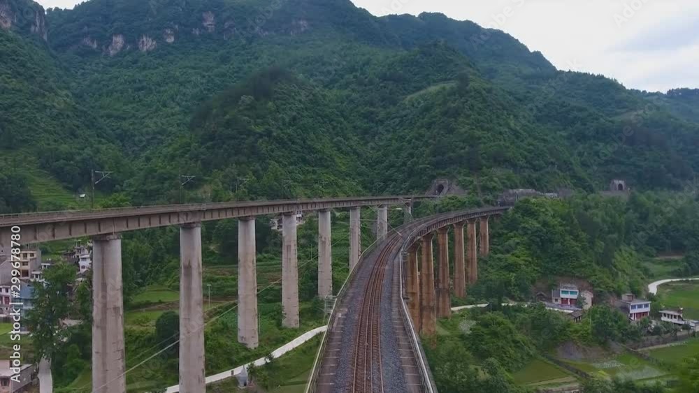 China, Zhenyuan County, Guizhou. Aerial view of the railroad going over the bridge in Kaili District China, Zhenyuan County, Guizhou. Aerial view of the railroad going over the bridge in Kaili District