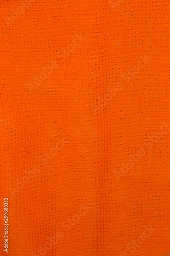 This is a photograph of Orange neon fabric
