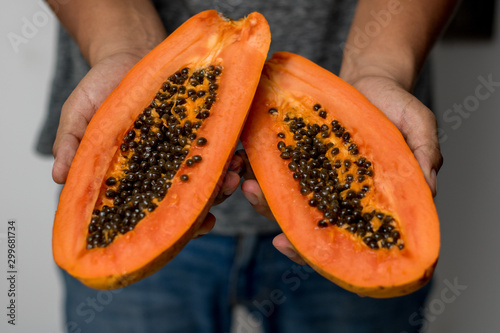 man hands holding fresh papaya