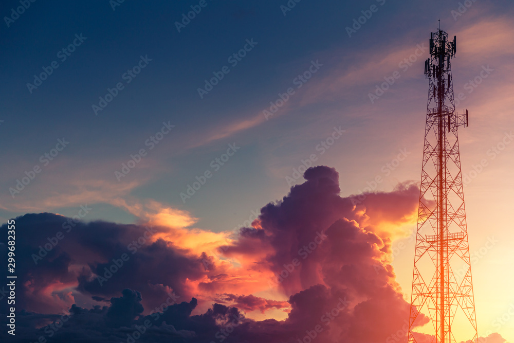 Dramatic dusk sky colorful cloud with communication signal tower silhouette.