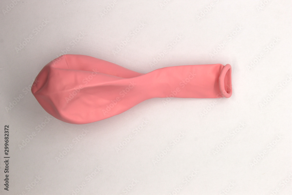 This is a photograph of a Pink Balloon isolated on a White background This is a photograph of a Pink Balloon isolated on a White background