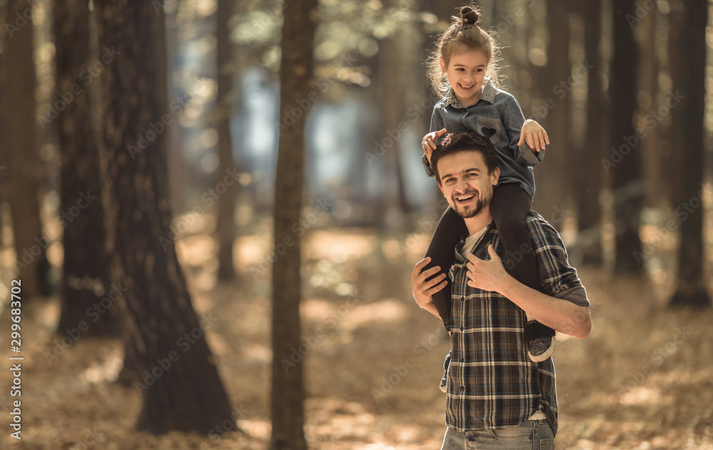Dad and daughter walking in the autumn forest. Dad and daughter walking in the autumn forest.