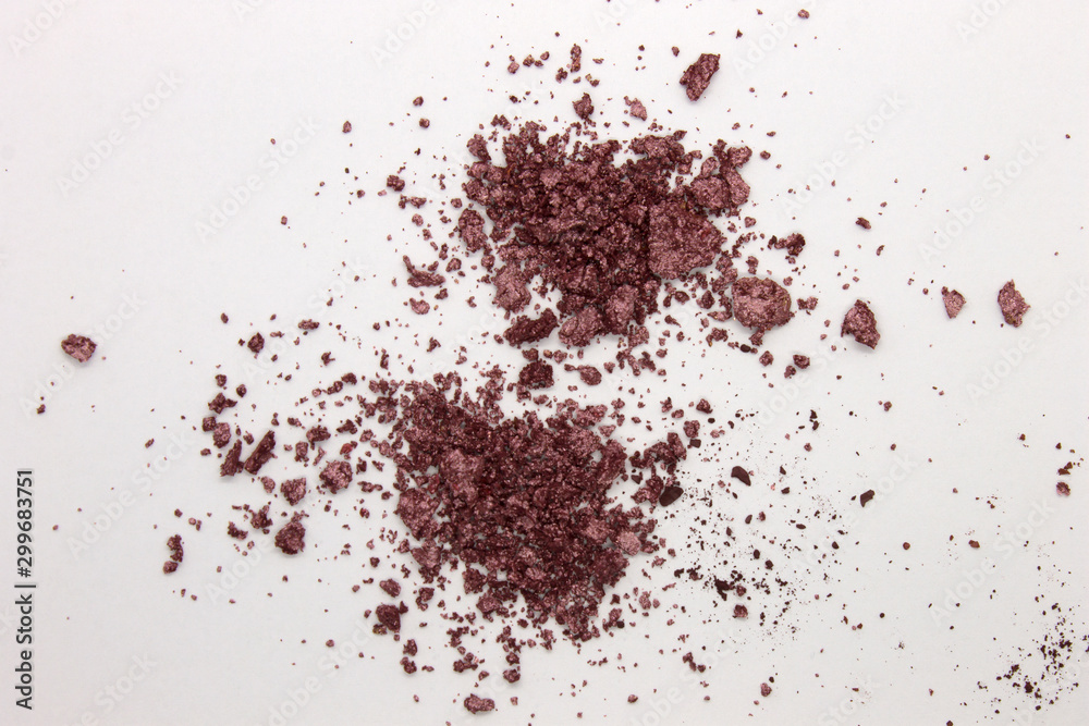 This is a photograph of a Metallic Purple Powder Eyeshadow isolated on a White Background