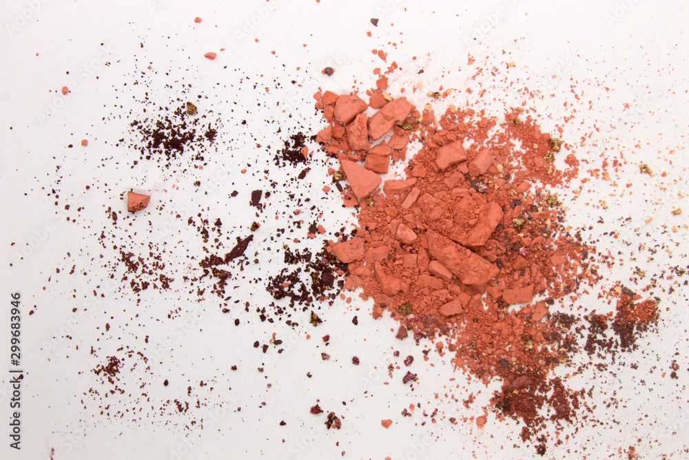 This is a photograph of peach colored Powder Eyeshadow isolated on a White Background