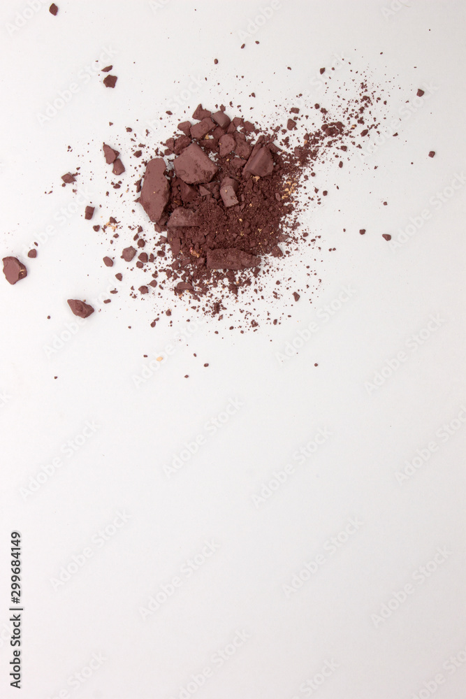 This is a photograph of a Matte Light Mahogany Powder Eyeshadow isolated on a White Background