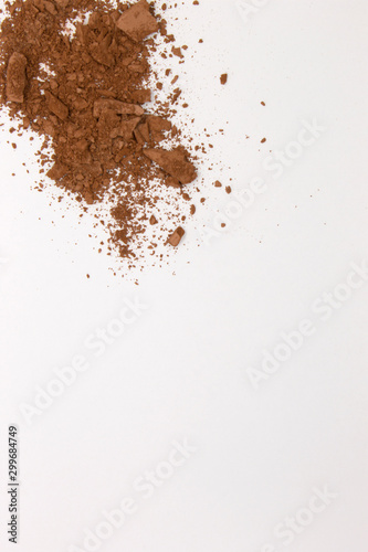 This is a photograph of a Matte Brown Powder Eyeshadow isolated on a White Background