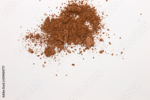 This is a photograph of a Matte Brown Powder Eyeshadow isolated on a White Background