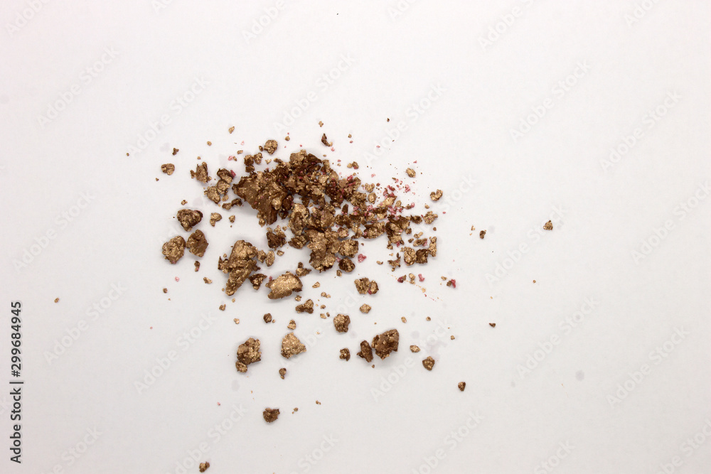 This is a photograph of a Metallic Gold Powder Eyeshadow isolated on a White Background