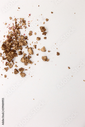 This is a photograph of a Metallic Gold Powder Eyeshadow isolated on a White Background