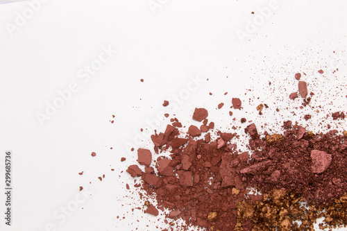 This is a photograph of a Burgundy,Metallic Bronze,and Burnt Umber Powder Eyeshadow isolated on a White Background