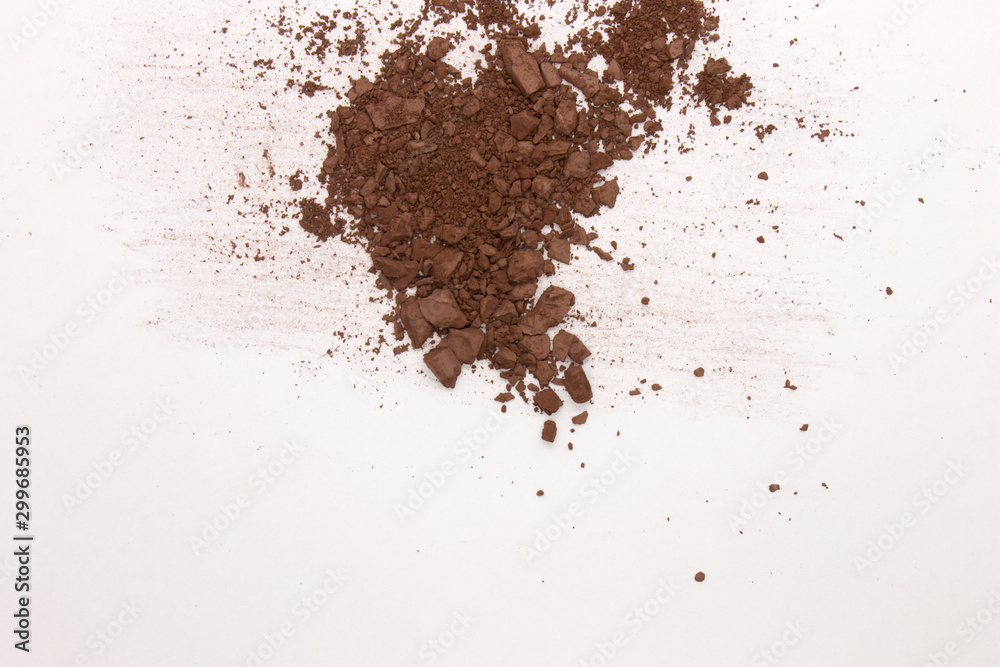 This is a photograph of a Dark Brown Powder Eyeshadow isolated on a White Background This is a photograph of a Dark Brown Powder Eyeshadow isolated on a White Background