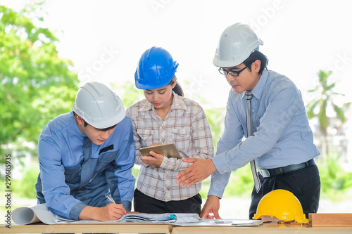 Asian engineers were consulted together and plan in construction