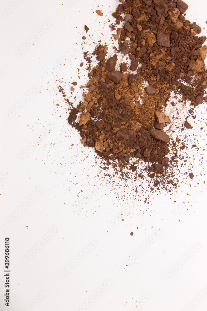 This is a photograph of Brown Powder Eyeshadow isolated on a White Background