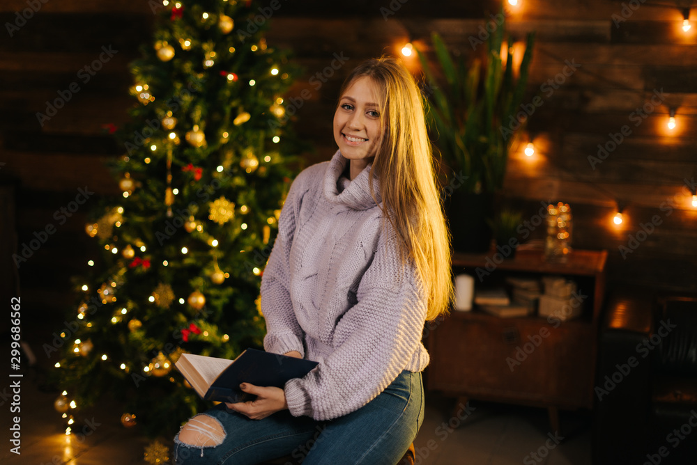 Beautiful girl in cozy sweater posing 