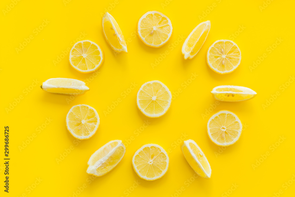 Lemon circle pattern on yellow background top view
