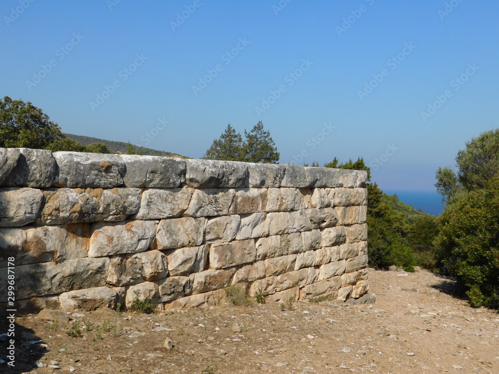 An ancient wall in the ancient city of Rhamnous, in Attica, Greece