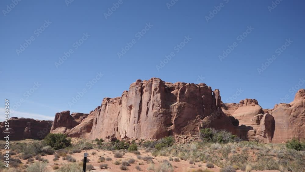 SANDSTONE WALL. Natural Rock Formation in Moab, Utah. You could see hundreds of these monstrous formations along the road as you Drive. SANDSTONE WALL. Natural Rock Formation in Moab, Utah. You could see hundreds of these monstrous formations along the road as you Drive.