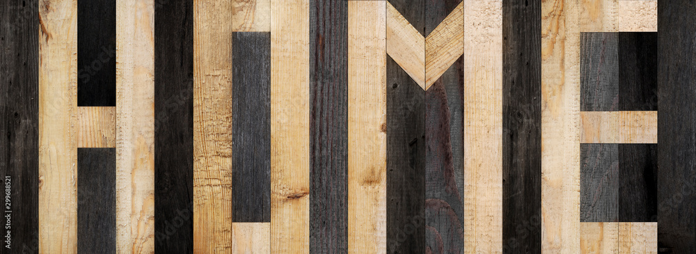 The word home is made of wooden planks. Wooden boards texture. Panel of planks for wall decoration The word home is made of wooden planks. Wooden boards texture. Panel of planks for wall decoration