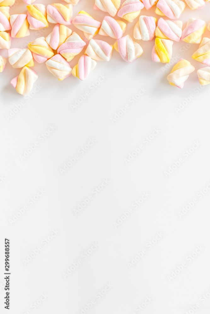 Candies. Marshmallows frame on white background top view space for text Candies. Marshmallows frame on white background top view space for text