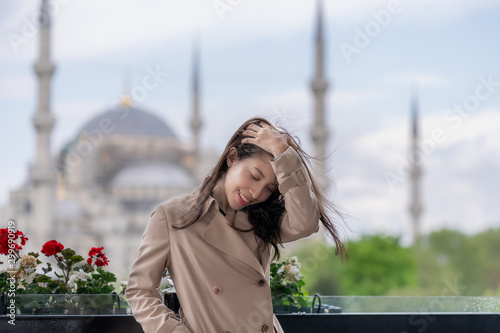 Canvas Print Woman portrait relaxing in Istanbul near Hagia Sophia famous islamic Landmark mosque
